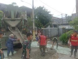 Meski Diguyur Gerimis, Pekerjaan TMMD di Sukamaju Tetap Berjalan Optimal